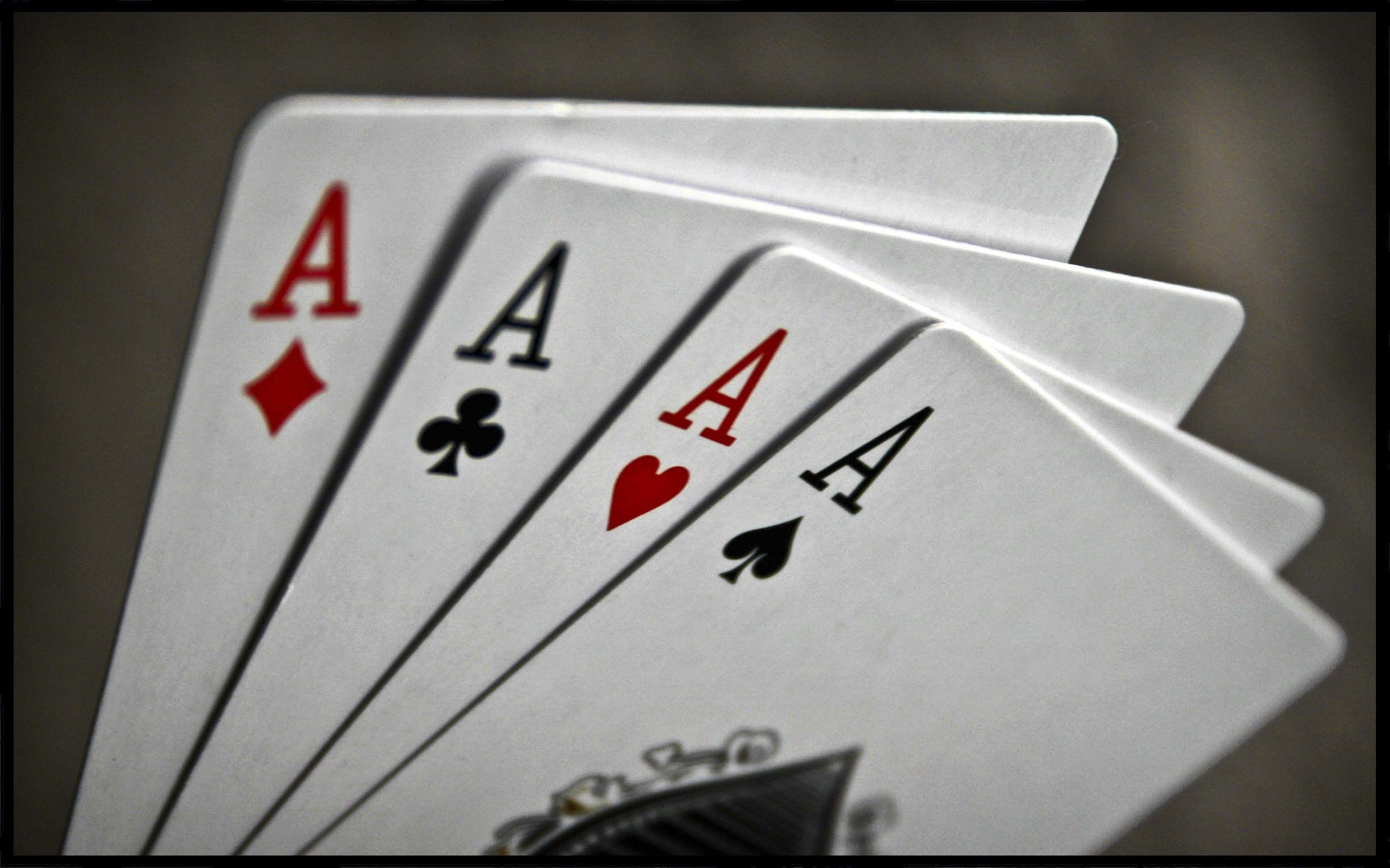 Close-up of poker cards being dealt at the table