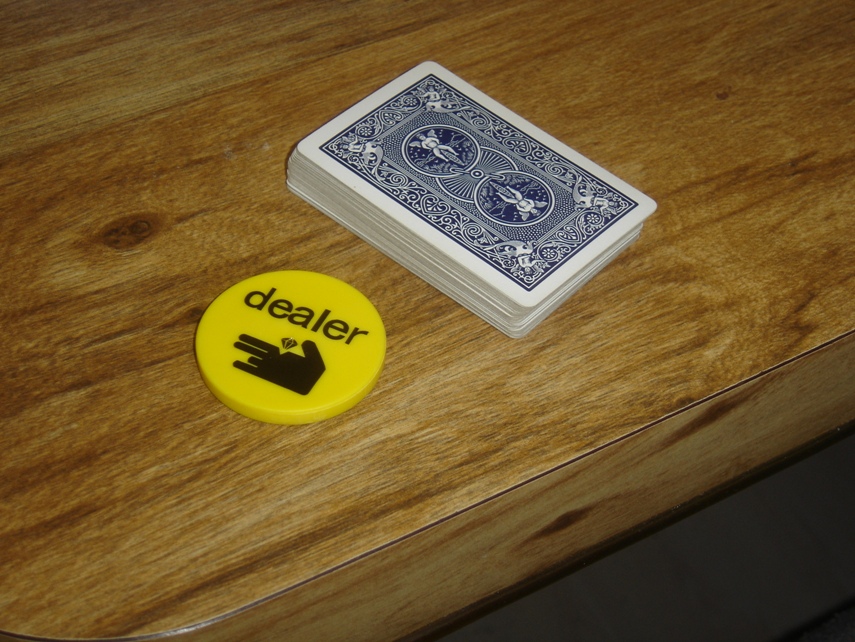 Online vs live poker dealer button and cards
