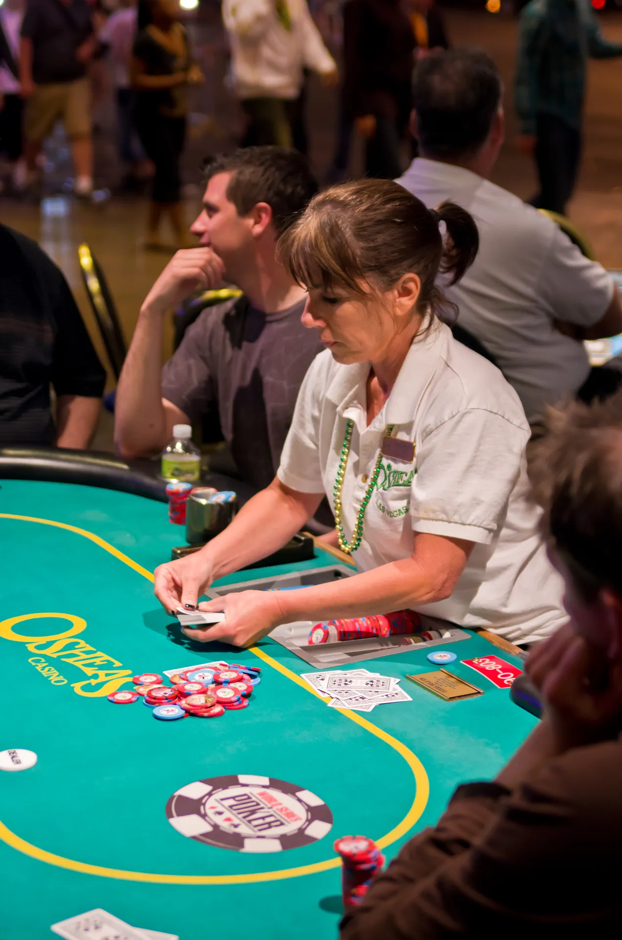 Poker players reading opponents at a casino table